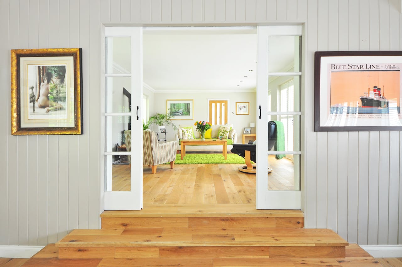 doorway-looking-into-white-living-room-with-green-rug