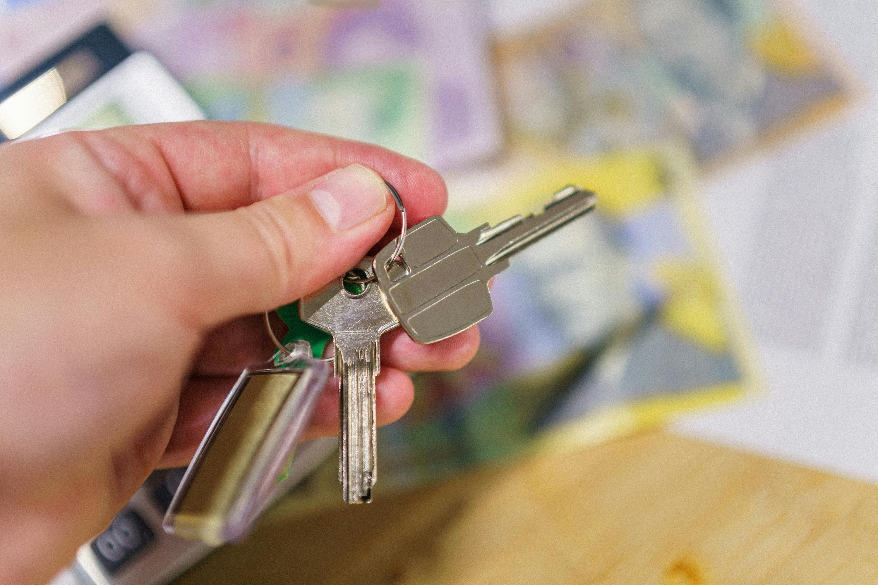 person-holding-keys