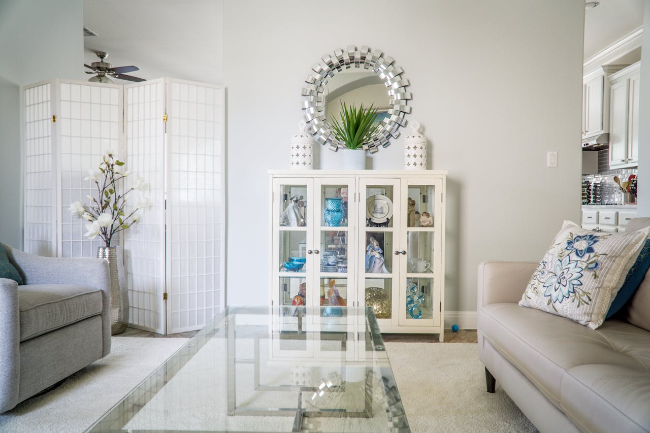 living-room-with-white-walls-white-couches-round-mirror living-room-with-white-walls-white-couches-round-mirror
